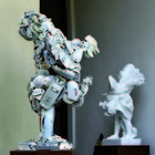 Dario Tironi - Child holding a rooster - assembled plastic next to the marble sculpture of Child holding a rooster